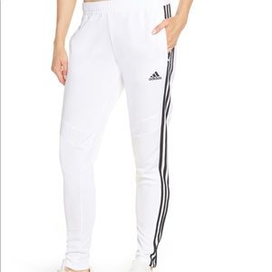 White Adidas jogger pants with black stripes